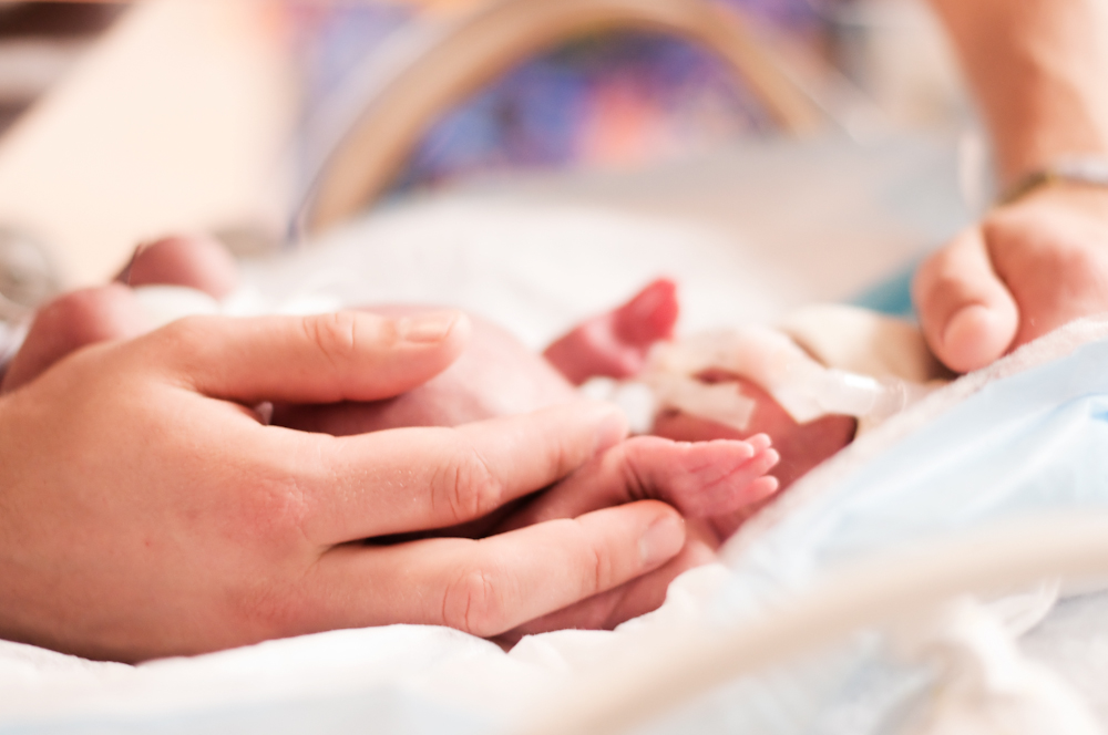 Adult Hand with Preemie